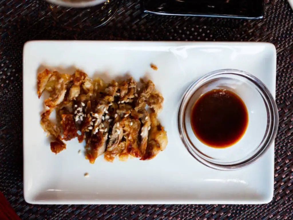 soy sauce in a plate with other food